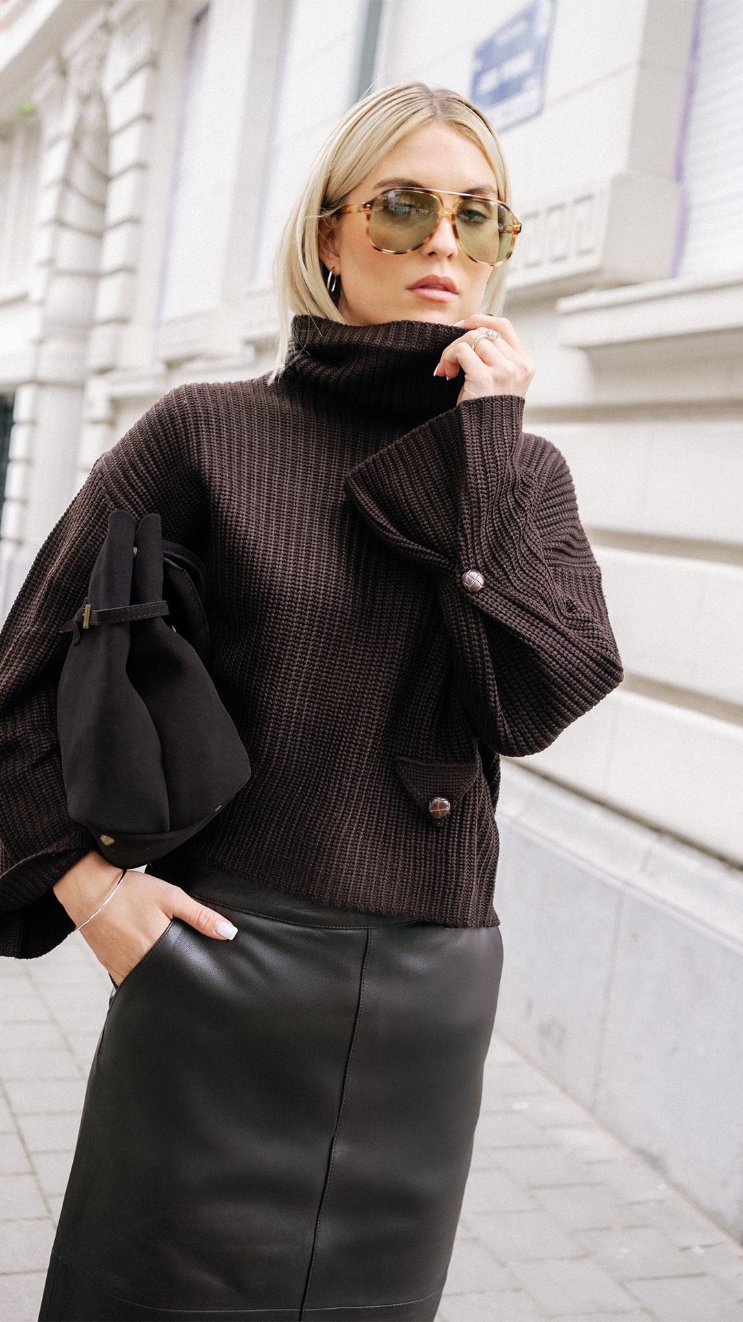 A statement knit with a flattering boxy fit, featuring exquisite sleeve details that add a touch of sophistication. Bold yet elegant.